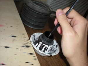 Dipping brush in ink