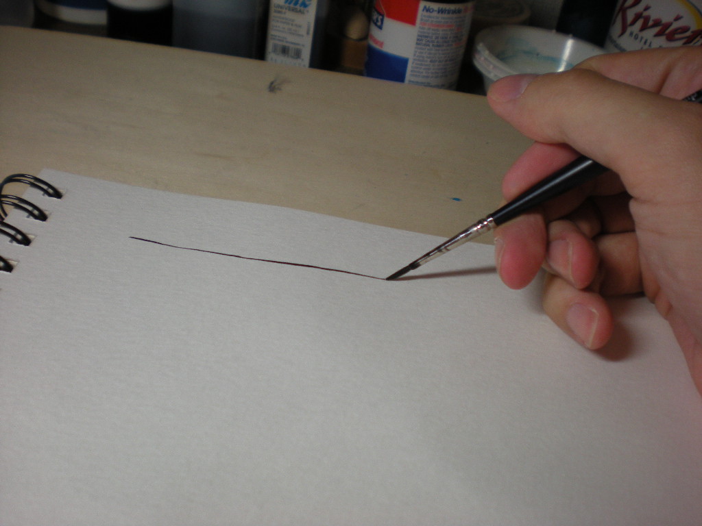 Drawing a line with brush and ink