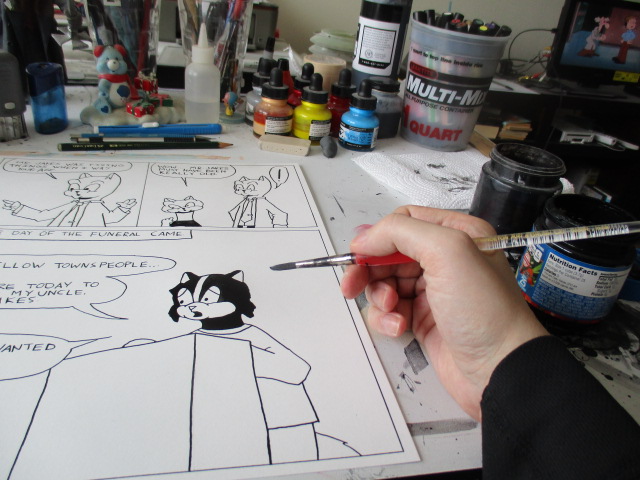 Applying ink with a round size 5 brush to a Sunnyville page